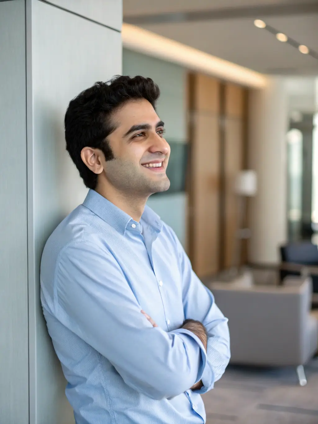 A professional headshot of a mentor, looking approachable, with a background suggesting a modern office in Bangalore. The mentor is wearing smart casual attire.